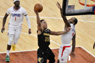 Memphis Grizzlies guard Desmond Bane (22) shoots against Los Angeles Clippers forward Kawhi Leonard (2) during the first half of an NBA basketball game Friday, Feb. 26, 2021, in Memphis, Tenn. (AP Photo/Brandon Dill)