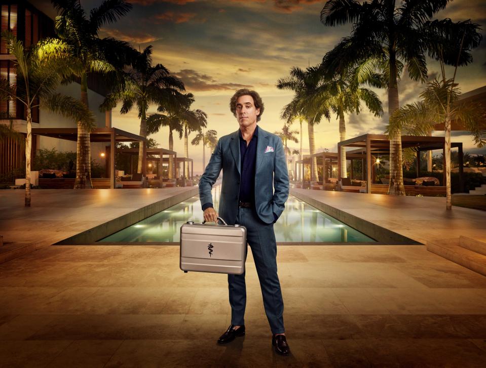 Stephen Mangan holding a brief case on The Fortune Hotel