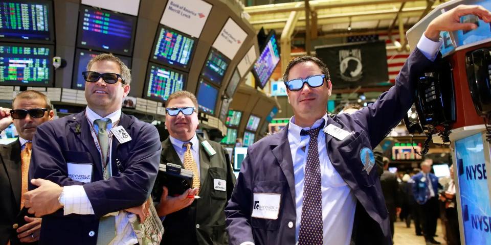 people wearing sunglasses on stock nyse floor