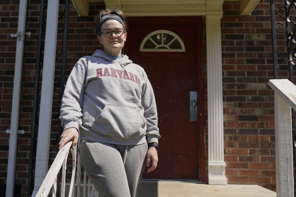 Samantha Richards stands outside of her apartment, Friday, June 9, 2023, in Bloomington, Ind. Richards has been on Medicaid her whole life and currently works two part-time jobs as a custodian. (AP Photo/Darron Cummings)