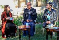 Thanoun Yahya, an Iraqi Christian sits with his wife and his son at his home which he reclaimed when Islamic State militants was driven out, in Mosul