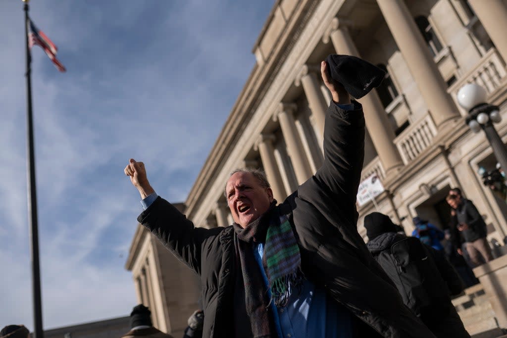 A supporter of Kyle Rittenhouse reacts as a not guilty verdict is read in front of the Kenosha County Courthouse on November 19, 2021 in Kenosha, Wisconsin (Getty Images)