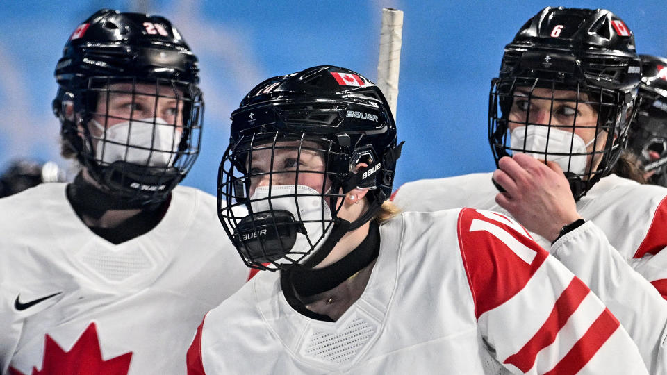 The Canadian women's hockey team wore masks for their matchup with Russia at the Beijing Olympics. (Photo by ANTHONY WALLACE/AFP via Getty Images)