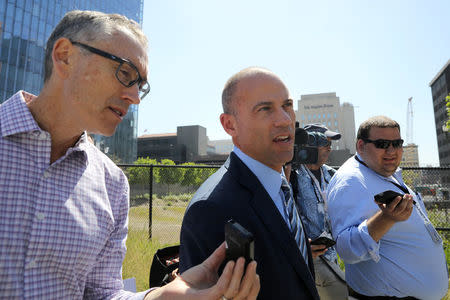Michael Avenatti (C), lawyer for adult-film actress Stephanie Clifford, also known as Stormy Daniels, speaks to the media outside the U.S. District Court for the Central District of California after a hearing regarding Clifford's case against Donald J. Trump in Los Angeles, California, April 20, 2018. REUTERS/Lucy Nicholson
