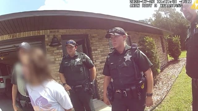 11-year-old girl in handcuffs as deputies arrest her.
