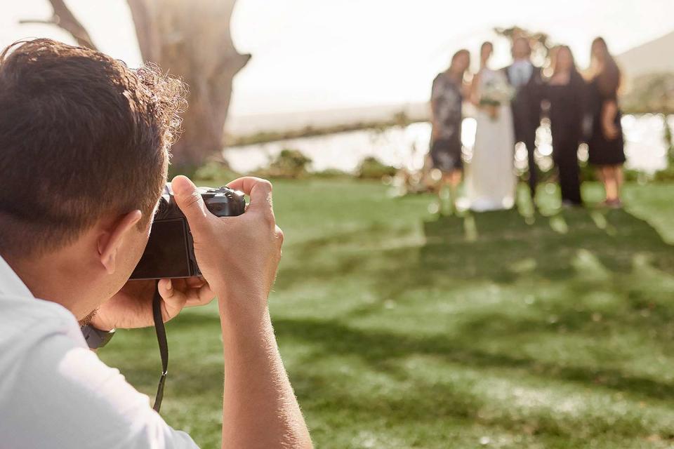 <p>Getty</p> stock photo of a wedding photographer