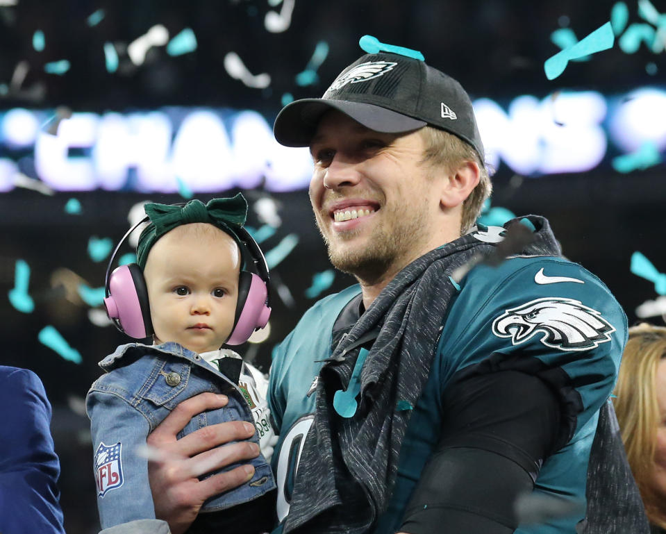 <p>Philadelphia Eagles quarterback Nick Foles (9) celebrates with his daughter Lily after defeating the New England Patriots in Super Bowl LII at U.S. Bank Stadium. Mandatory Credit: Winslow Townson-USA TODAY Sports </p>