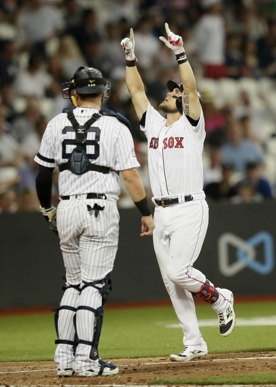 Boston Red Sox's Michael Chavis celebrates his three-run home run against the New York Yankees during the seventh inning of a baseball game, Saturday, June 29, 2019, in London. Major League Baseball made its European debut game Saturday at London Stadium. (AP Photo/Tim Ireland)