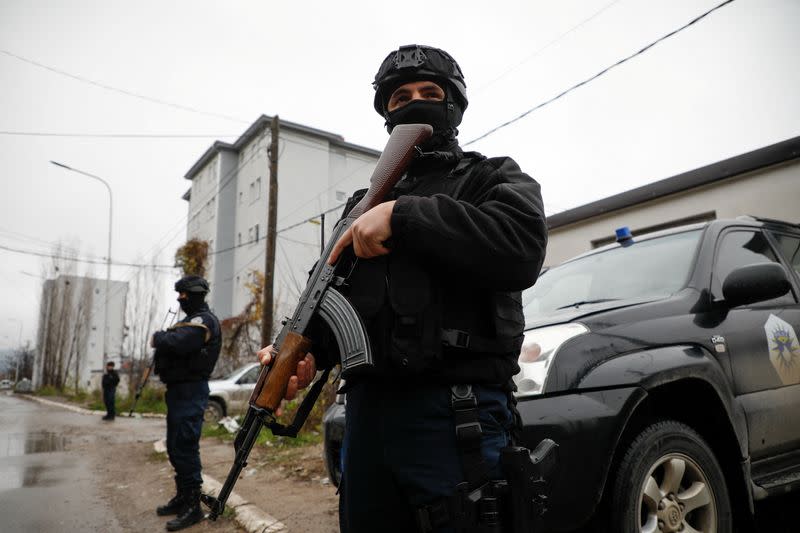 Kosovo police officers patrol an area in the northern part of the ethnically-divided town of Mitrovica