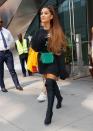 <p>Remember when I said you can copy Ariana's style by diving into a pile of sweatshirts? Yep, I wasn't kidding. Break up a black-on-black look by showing a little leg Ari style in over-the-knee sock boots. </p>