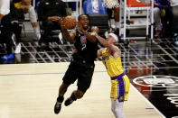 Los Angeles Clippers' Kawhi Leonard (2) goes to the basket and is fouled by Los Angeles Lakers' Alex Caruso (4) during the second half of an NBA basketball game Thursday, May 6, 2021, in Los Angeles. (AP Photo/Ringo H.W. Chiu)