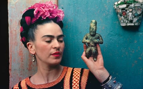 Kahlo in the garden at Casa Azul - Credit: Nickolas Muray /V&A 