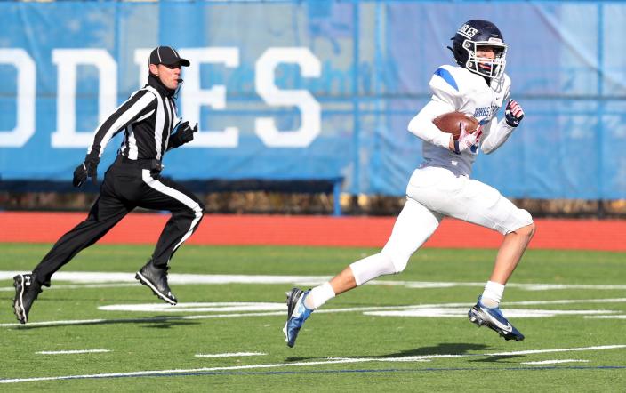 Dobbs Ferry&#39;s Jhonatan Almaras (5) runs for a first half touchdown after catching a pass against Schuylerville  during the Class C state semifinal at Middletown High School Nov. 27, 2021. 
