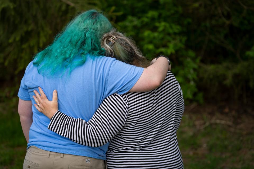 A mother embraces her 16-year-old transgender daughter Thursday, May 11, 2023, in Indianapolis. Both asked to remain anonymous. The family has been rooted in Indianapolis for decades but is considering leaving the state due to recent legislation passed that will ban gender-affirming medical care, such as hormones, for transgender children in the state.