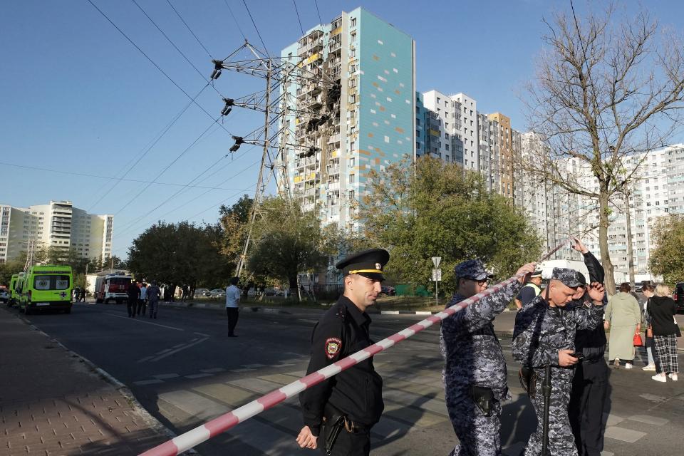 Russian police inspect the damaged residential building following a drone attack in Ramenskoye (Getty Images)