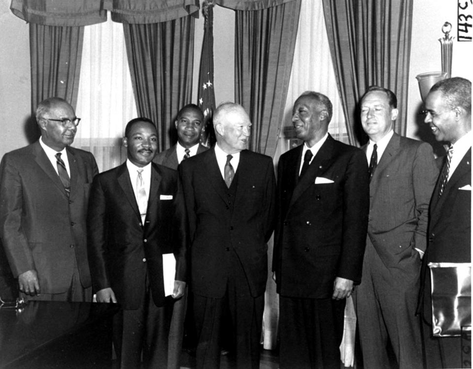 President Eisenhower poses in his office with black leaders with whom he discussed civil rights issues, including E. Frederic Morrow, rear, Martin Luther King, Jr., A. Philip Randolph, third from right, and Roy Wilkins, right, on June 23, 1958. Eisenhower was told that court ordered suspension of school integration at Little Rock, Arkansas "has shocked and outraged black citizens and millions of their fellow Americans."
