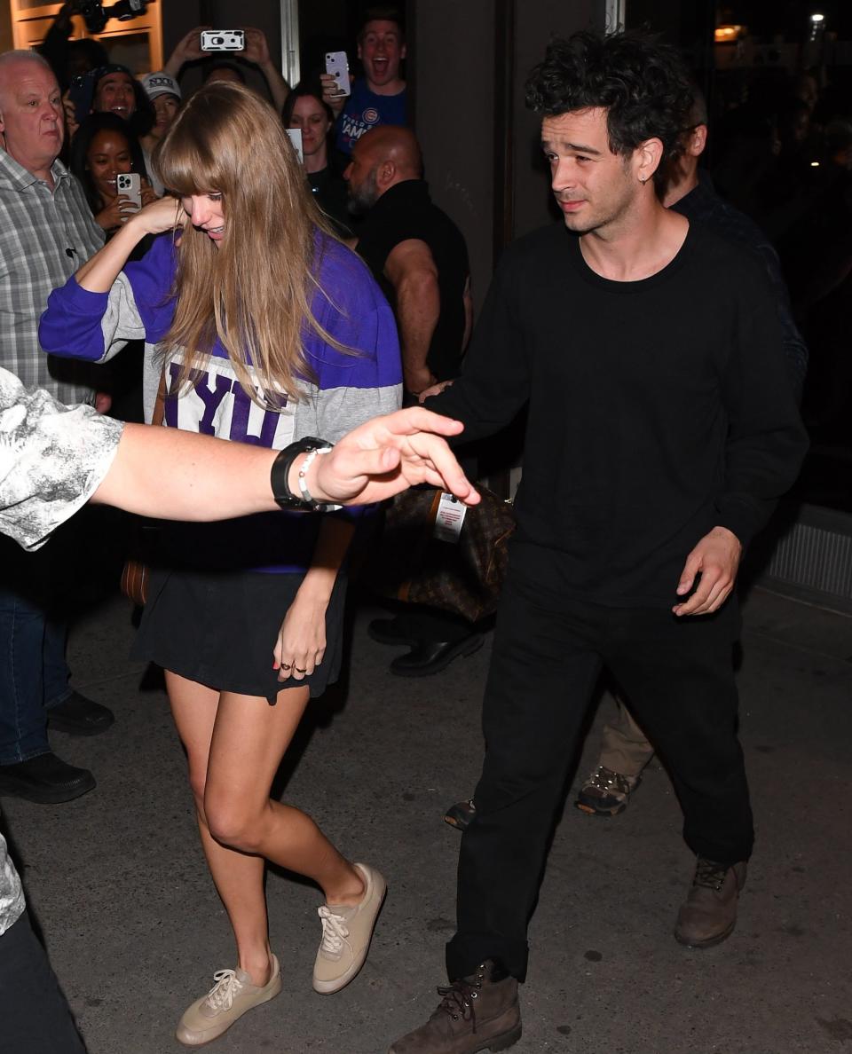 Taylor and Matty exit a building