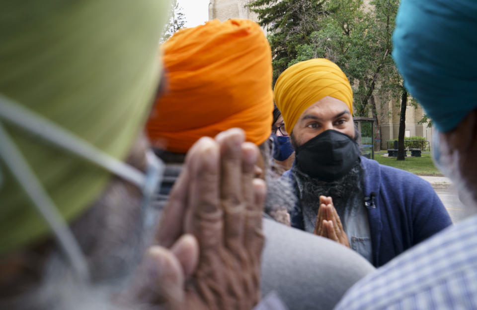 NDP leader Jagmeet Singh greets members of the Sikh community during a campaign stop in Regina, on Friday, August 20, 2021. THE CANADIAN PRESS/Paul Chiasson
