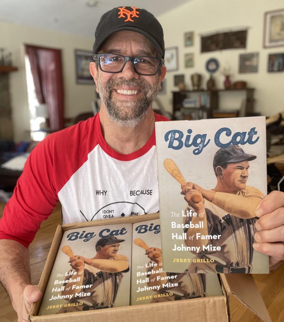 Author Jerry Grill with his book 'Big Cat' about baseball Hall of Famer Johnny Mize.