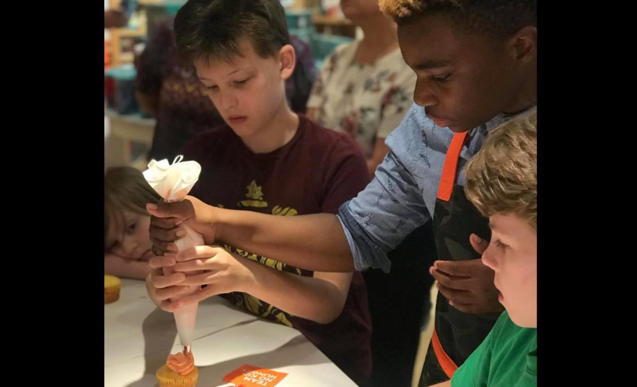 Michael Platt, 13, teaches a baking class to benefit the No Kids Hungry campaign. For every cupcake the young business owner sells, he donates to the homeless or the hungry. (Photo: Facebook)
