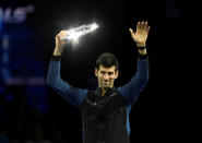 Tennis - ATP Finals - The O2, London, Britain - November 18, 2018 Second placed Serbia's Novak Djokovic celebrates with a trophy after losing the final against Germany's Alexander Zverev Action Images via Reuters/Tony O'Brien
