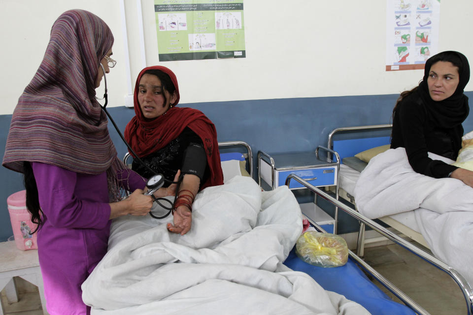 Afghan women and their newborns rest in the maternity ward of Ahmad Shah Baba District Hospital in Kabul, Afghanistan on Monday, Feb. 24, 2014. (AP Photo/Cassandra Vinograd)