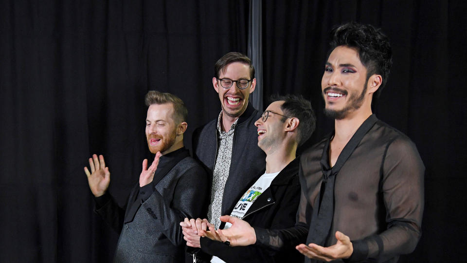 The Try Guys laughing and smiling in formal attire, with Eugene Lee Yang in the foreground. (Kevin Mazur / Getty Images file )