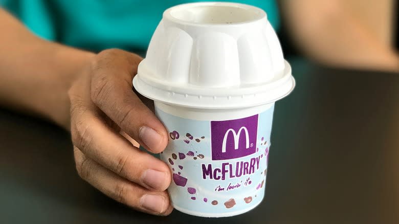 Hand holding McDonald's McFlurry