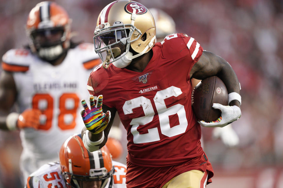 FILE - In this Monday, Oct. 7, 2019 file photo, San Francisco 49ers running back Tevin Coleman (26) runs for a touchdown against the Cleveland Browns during the first half of an NFL football game in Santa Clara, Calif. The New York Jets added experience and depth on both sides of the ball with their latest moves in free agency. The team announced Wednesday, March 24, 2021 it signed former Philadelphia Eagles defensive end Vinny Curry, who'll provide an already formidable D-line a veteran pass-rushing presence. The Jets also agreed to terms on a one-year contract with running back Tevin Coleman. (AP Photo/Tony Avelar, File)