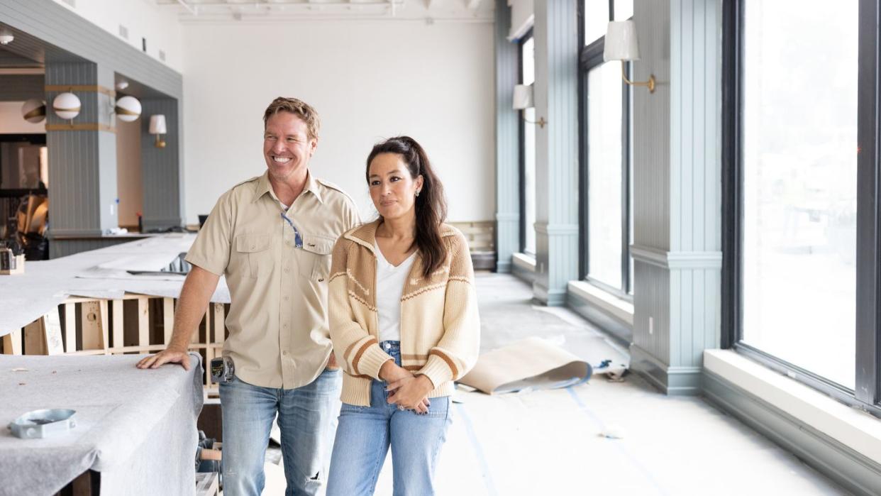 hosts, chip and joanna gaines discuss construction progress, as seen on the hotel