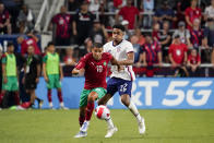 FILE - Morocco midfielder Younès Belhanda (10) dribbles past the United States' Reggie Cannon (22) during the second half of a friendly soccer match, Wednesday, June 1, 2022, in Cincinnati. The United States defeated Morocco 3-0. (AP Photo/Jeff Dean, File)