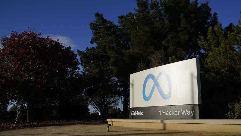 Meta’s logo can be seen on a sign at the company’s headquarters in Menlo Park, Calif., Wednesday, Nov. 9, 2022. The company announced an additional round of layoffs on March 14, 2023, cutting 10,000 jobs. (AP Photo/Godofredo A. Vásquez)