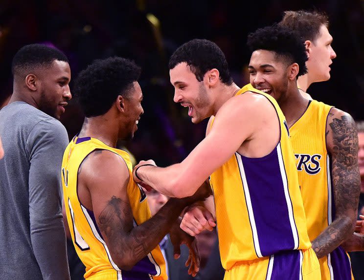 Nick Young and his teammates celebrate an improbable winner. (Getty Images)