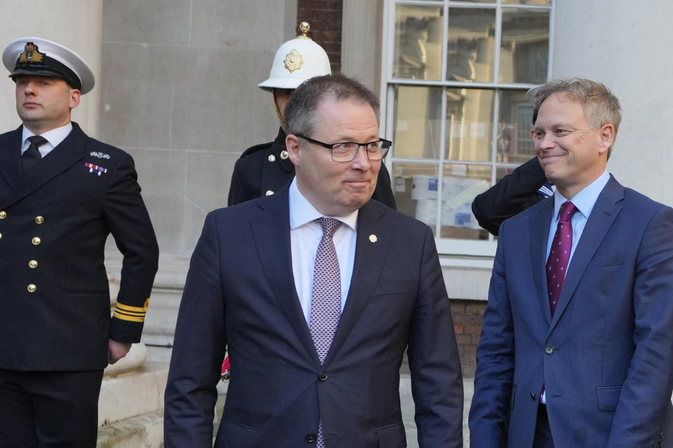Defence Secretary Grant Shapps, right, smiles with Norway's Minister of Defence Bjorn Arild Gram during a meeting in London, Monday, Dec. 11, 2023. Britain's Ministry of Defense is transferring two minehunting ships to Ukraine as part of a package of long-term support to bolster security in the Black Sea. The transfer comes as Britain and Norway announce plans for a new maritime coalition to increase support for Ukraine in the war with Russia. (AP Photo/Kirsty Wigglesworth)