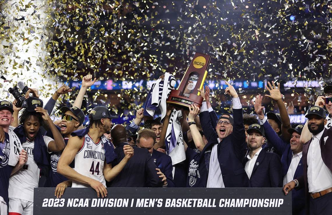 Connecticut coach Dan Hurley holds up the championship trophy after the Huskies defeated San Diego State 76-59 to win the 2023 men’s NCAA Tournament championship.