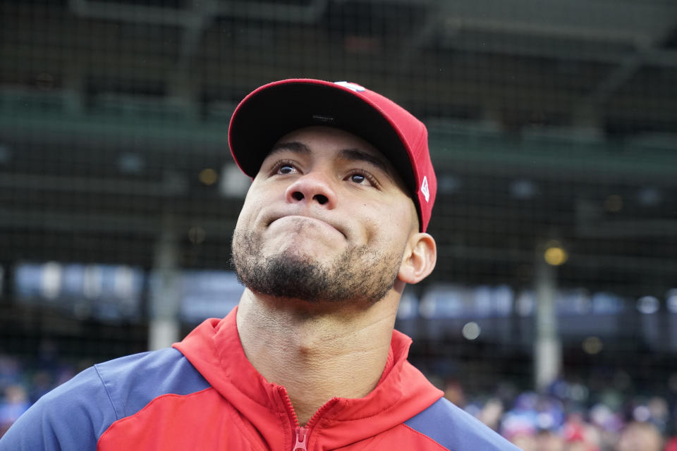 St. Louis Cardinals' Willson Contreras reacts as the Chicago Cubs pay a video tribute to him before a baseball game on Monday, May 8, 2023, in Chicago. Contreras returned to Wrigley Field for the first time since leaving the Cubs after last season. (AP Photo/Charles Rex Arbogast)