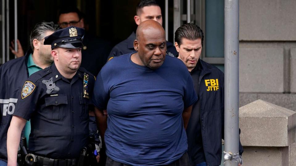 PHOTO: FILE - New York City police and law enforcement officials lead subway shooting suspect Frank James, center, away from a police station in New York on April 13, 2022. (Seth Wenig/AP)