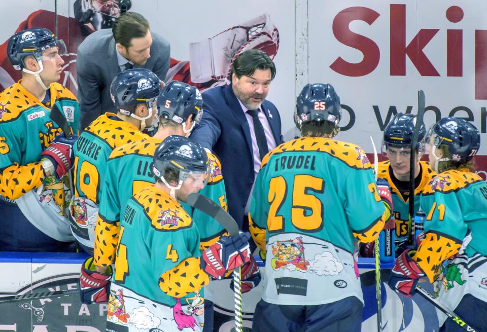 Peoria Rivermen head coach Jean-Guy Trudel, middle, and assistant coach Eric Levine confer with their team as they battle Evansville on Friday, Dec. 8, 2023 at Carver Arena. The Rivermen defeated the Thunderbolts 5-4.