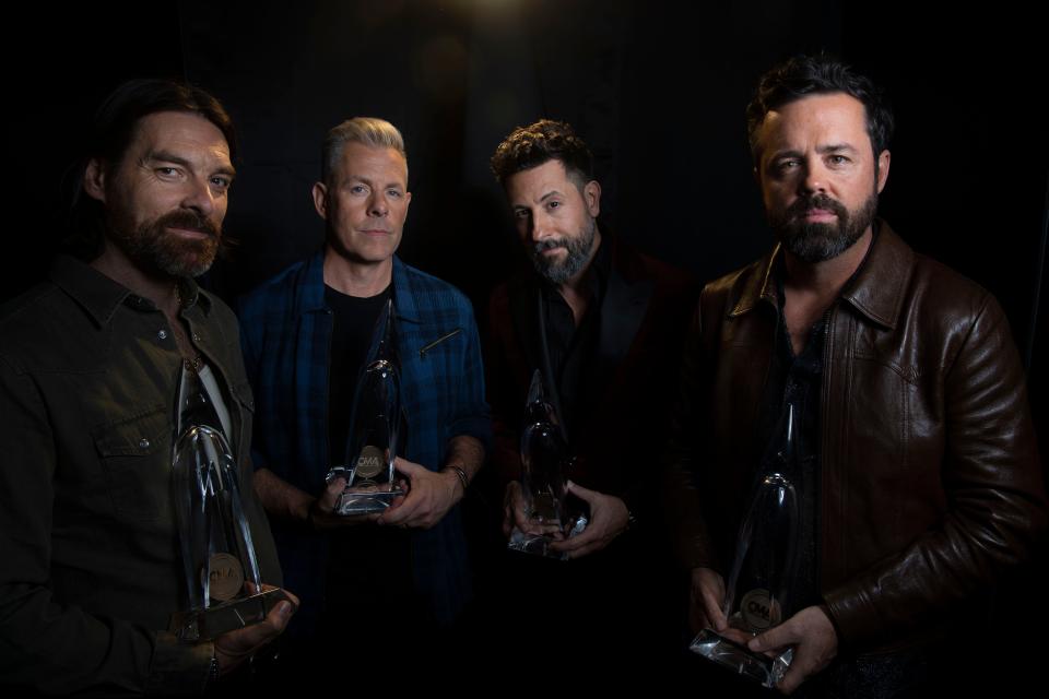 Old Dominion stands backstage with their awards for Group of the Year during the CMA Awards at Bridgestone Arena in Nashville, Tenn., Wednesday, Nov. 8, 2023. Matthew Ramsey of Old Dominion told the Tennessean when it comes to their connection to the country music space and the cross over of pop music, "I would say the main thing is our acceptance of who we are and where we are as a people and an institution and as a band,” Ramsey said, “We’re open enough to learn more about who our fans are, we just kind of let go of a lot and it’s worked out for us."