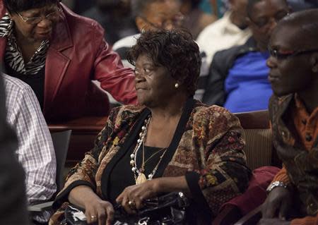 Aime Ruffner receives support from family and friends after testifying at the hearing to reopen the case for her brother George Stinney Jr. in Sumter, South Carolina January 21, 2014. REUTERS/Randall Hill