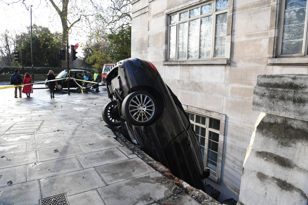 A Mercedes C Class car which crashed through some railings into the basement of a luxury apartment block at Lancaster Terrace, London.