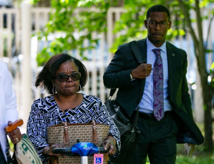 Sharon Lettman-Hicks arrives at the Federal Courthouse with her defense attorney Mutaqee Akbar for a pretrial hearing Monday, April 10, 2023. 