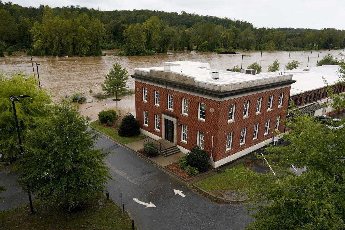 Torrential rains are flooding the mountains of North Carolina, posing the risk of a dam bursting