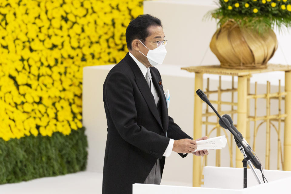 Japan's Prime Minister Fumio Kishida speaks during a memorial service marking the 77th anniversary of Japan's World War II defeat, at the Nippon Budokan hall in Tokyo, Monday, Aug. 15, 2022. (Yuichi Yamazaki/Pool Photo via AP)