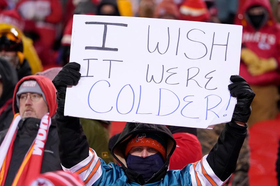 A fan holds up a sign before an NFL wild-card playoff football game between the Kansas City Chiefs and the Miami Dolphins on Saturday, Jan. 13, 2024, in Kansas City, Mo. (AP Photo/Ed Zurga) ORG XMIT: CAJC113