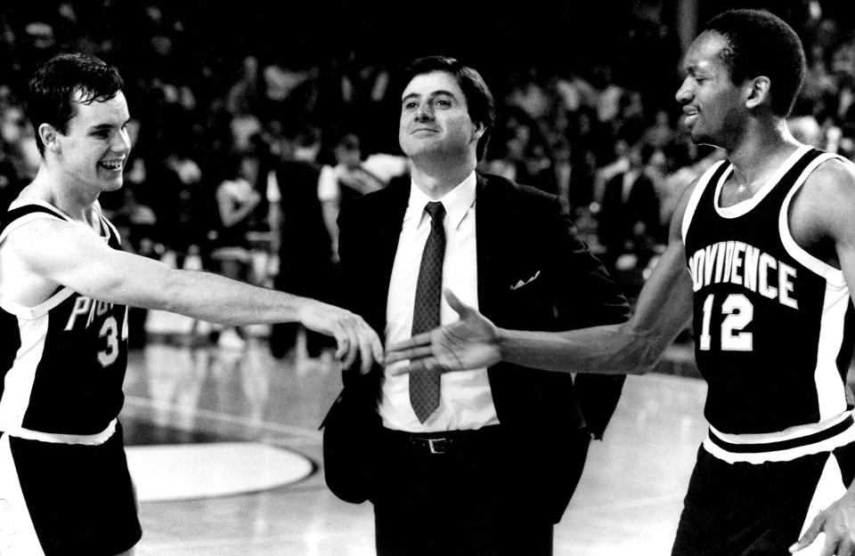 Providence coach Rick Pitino stands between players Billy Donovan, left, and Delray Brooks as they congratulate each other after their 103-82 victory over Alabama in the Southeast Regional semifinal game in Louisville in March 1987.