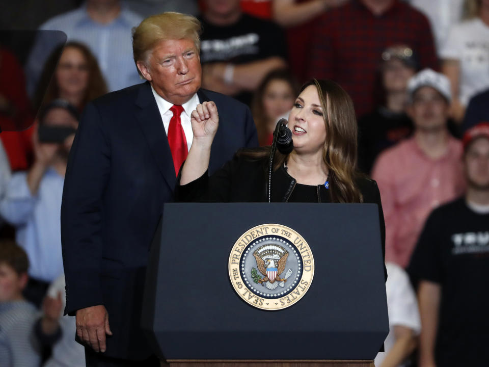 FILE - President Donald Trump listens as Republican National Committee chair Ronna McDaniel, right, speaks during a campaign rally Nov. 5, 2018, in Cape Girardeau, Mo. Trump is calling for a leadership change at the RNC in an attempt to install a new slate of loyalists, including his daughter-in-law, at the top of the GOP's political machine even before he formally secures the party's next presidential nomination. Trump outlined his plans on social media Monday night, Feb. 12, 2024.(AP Photo/Jeff Roberson, File)