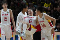 China's Wu Tongtong is carried from the court by teammates during their gold medal game at the women's Basketball World Cup against the the United States in Sydney, Australia, Saturday, Oct. 1, 2022. (AP Photo/Mark Baker)