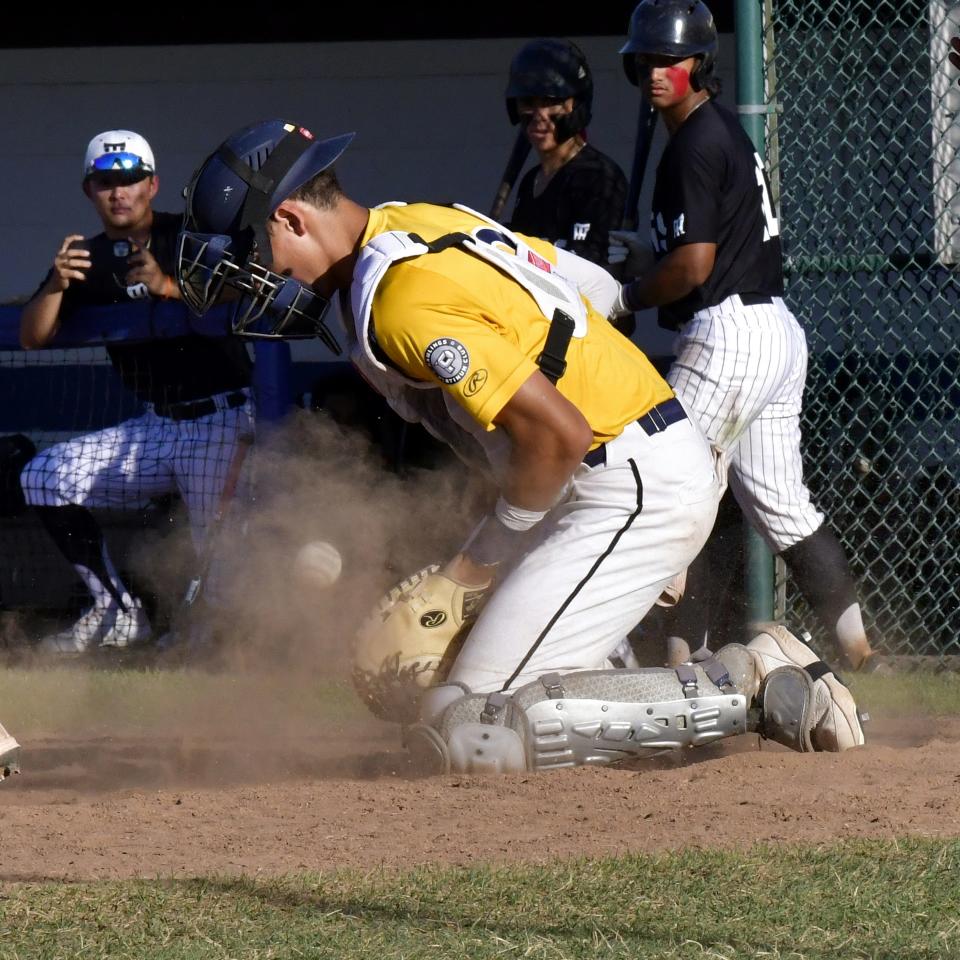 Centerville's Matthew Graveline makes a stop behind the plate for Midland 18U, June 28, 2022.