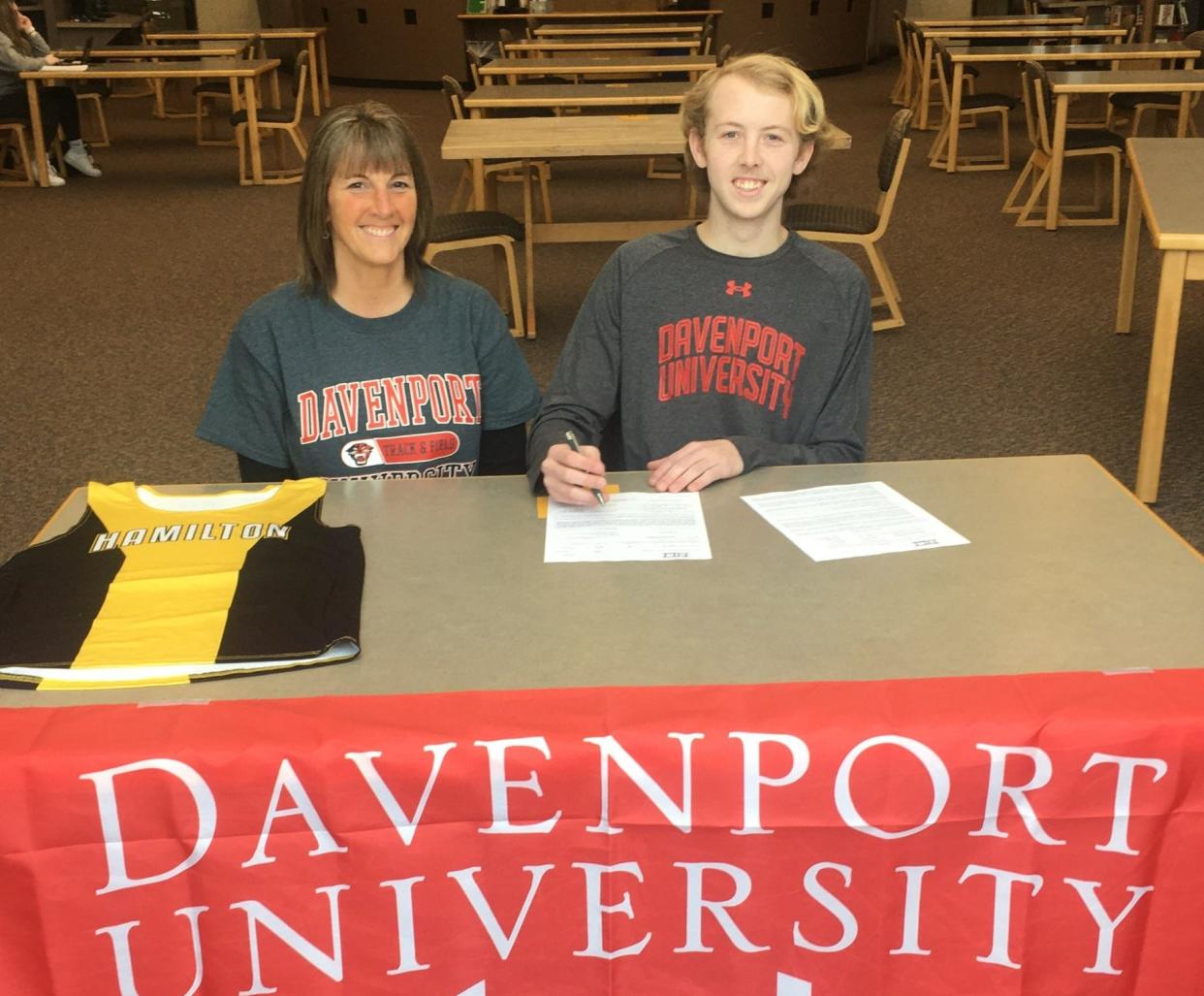 Hamilton's Owen Alderink (right) signs with Davenport.